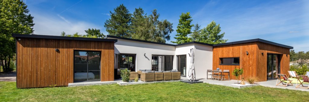 Découvrez la maison en bois avec des murs enduits - Trecobois